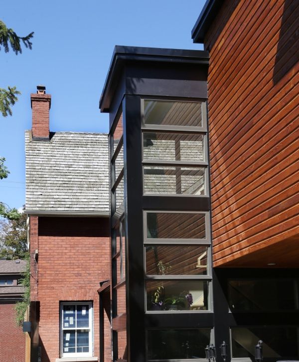 Cedar box addition with black windows